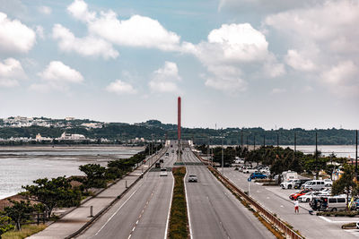 Road by city against sky