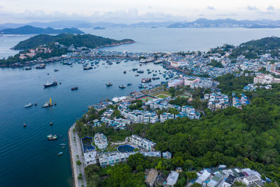 High angle view of townscape and sea against sky