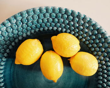 Close-up of lemons on plate