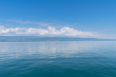 Scenic view of sea against blue sky