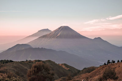 Scenic view of mountains against sky during sunset