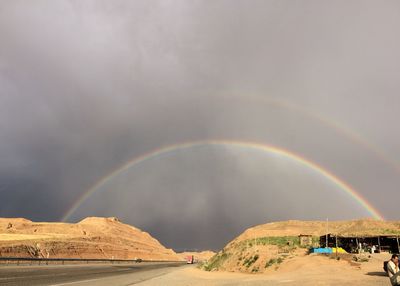 Scenic view of rainbow over landscape