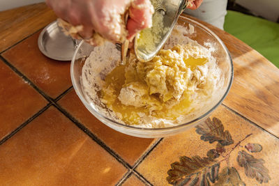 High angle view of person preparing food on table