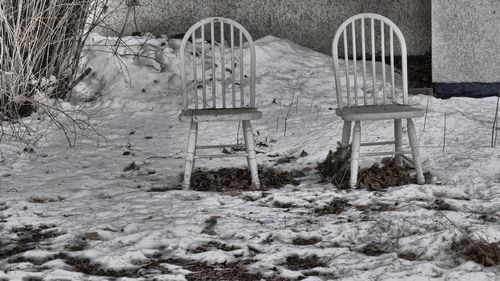 Chairs in snow