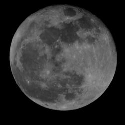 Low angle view of half moon against sky at night