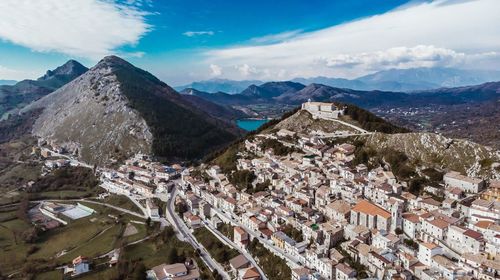 High angle view of townscape and mountains