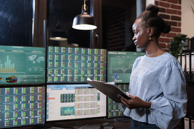 Female trader working in office