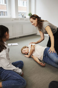 Teacher giving first aid training