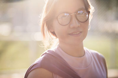 Portrait of smiling woman standing outdoors