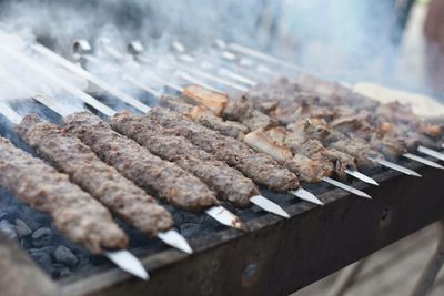 High angle view of meat on barbecue grill