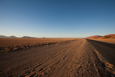 Scenic view of desert against clear sky