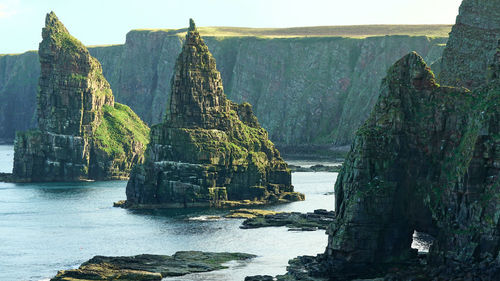 Panoramic view of rock formation in sea