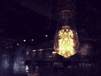 Close-up of illuminated light bulb