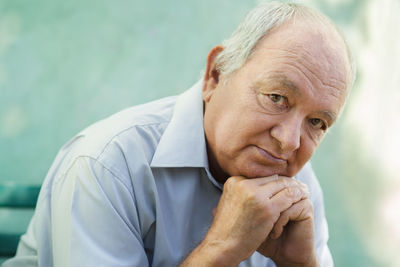 Close-up portrait of man against blurred background