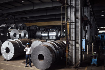 Full length of man working in factory