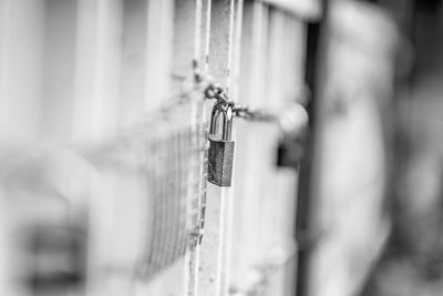 Close-up of padlock on railing