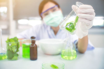 Close-up of woman working in laboratory