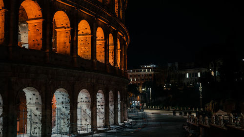 Illuminated buildings in city at night colosseo colosseum 