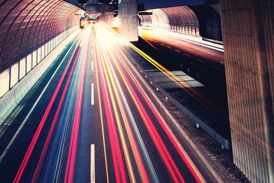 High angle view of light trails on road at night