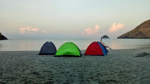 Scenic view of beach against sky during sunset