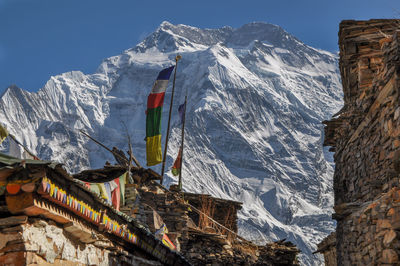 Panoramic view of snowcapped mountains against clear sky