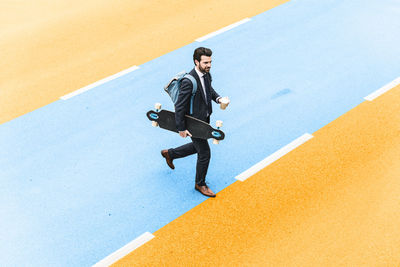 High angle view of young man walking outdoors