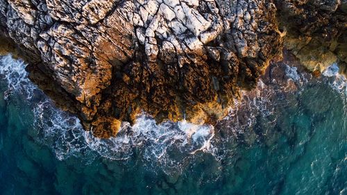 Close-up of rock formation in sea