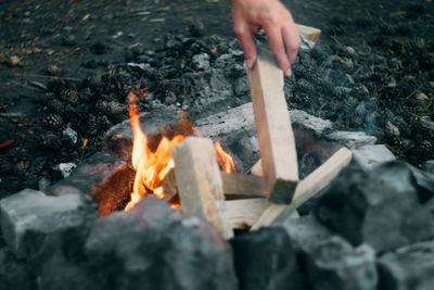 Midsection of man preparing food outdoors