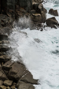 Waves splashing on rocks