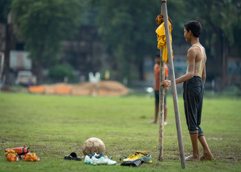 Full length of man playing on field