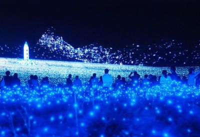 Group of people watching light show