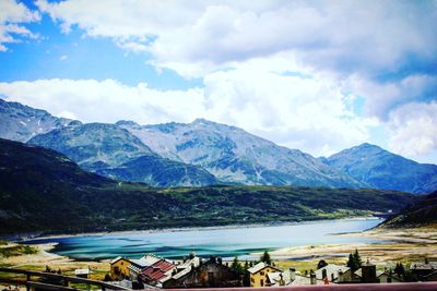 Panoramic view of houses and mountains against sky