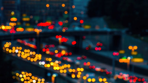 Illuminated cityscape at night,lighting from vihicle on road