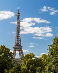Low angle view of eiffel tower against blue sky