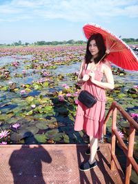 Portrait of woman with pink flowers