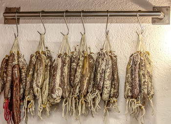 Selling handicraft fuets on the wall of a shop in spain