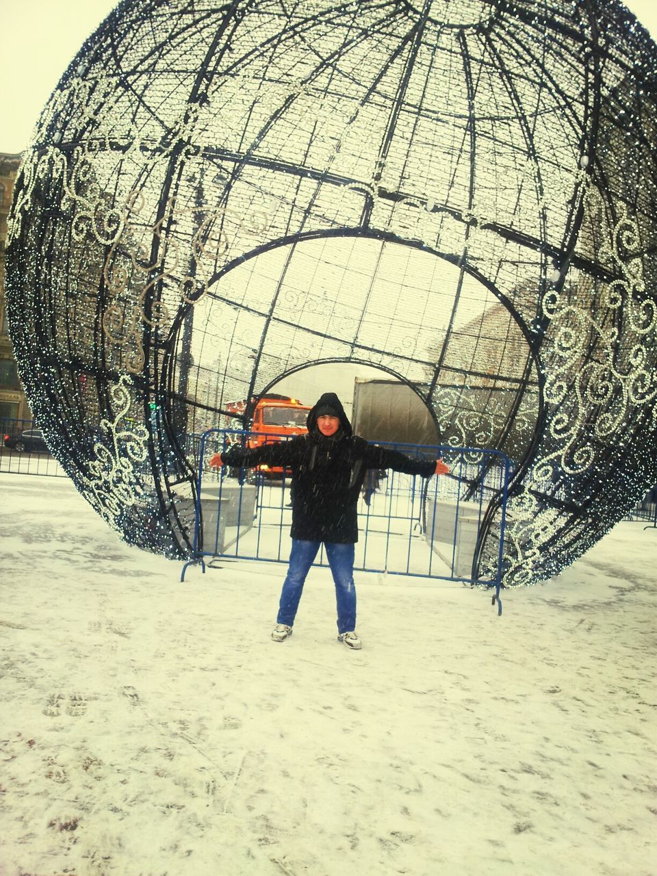 lifestyles, leisure activity, full length, sky, protection, umbrella, rear view, circle, day, built structure, standing, pattern, men, outdoors, architecture, sunlight, art and craft, arts culture and entertainment