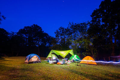 View of tent in field at night