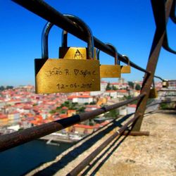 Close-up of padlocks on railing