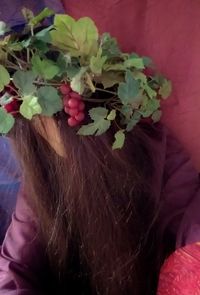 Close-up of woman with flowers in hair