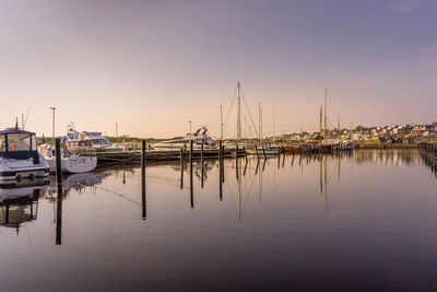 Fishing boats in marina at harbor