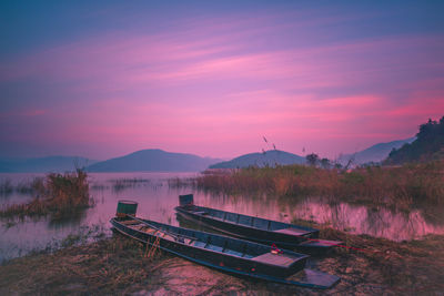 Scenic view of lake against sky during sunset