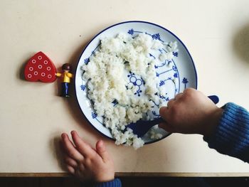 Cropped image of hand holding ice cream