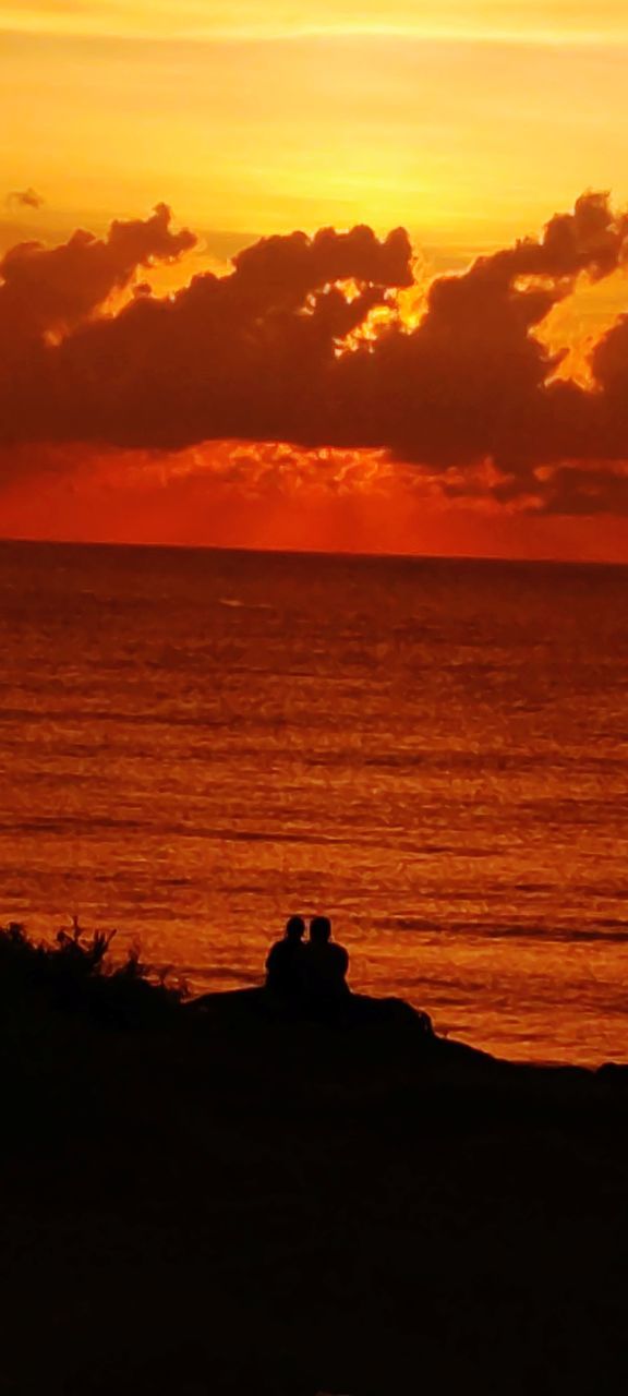 SCENIC VIEW OF SUNSET OVER SEA