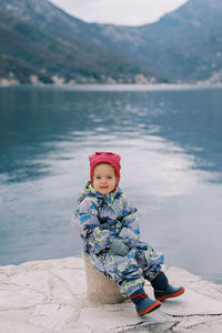 Full length of boy standing at beach