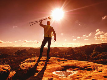 Rear view of man standing on mountain