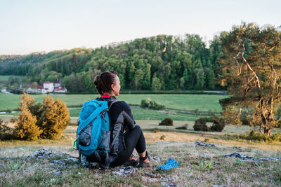 Woman having a break while hiking in eselsburger tal.