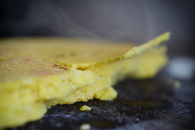 Close-up of yellow leaf on wooden table