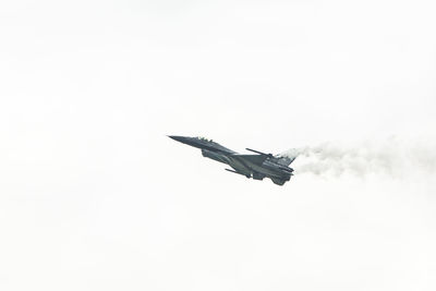 Low angle view of airplane flying in sky