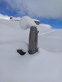 Snow on field against sky